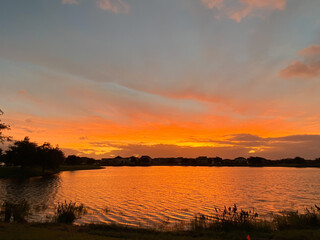 Fototapeta na wymiar Beautiful pink, orange and blue sunset reflecting on a lake