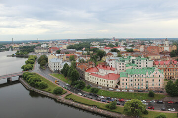 Top view of the beautiful old town, water and cozy colored houses, Russia, Vyborg. 