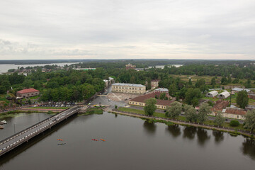 Panorama. Colorful kayaks are floating on the river. Ship, boats and bridge in Vyborg, Russia
