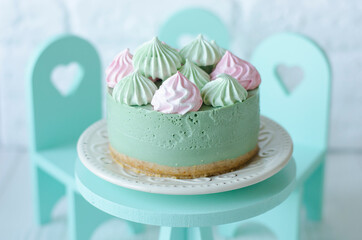 Cheesecake without baking with matcha tea on a table