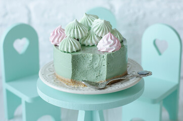 Cheesecake without baking with matcha tea on a table