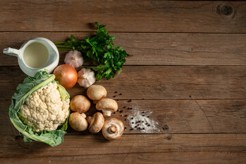 Obraz na płótnie Canvas A set of products for the preparation of fried champignons with creamy cauliflower puree