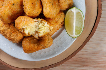 .Codfish cake, very traditional in Portuguese cuisine. Made of cod and potato. Top view