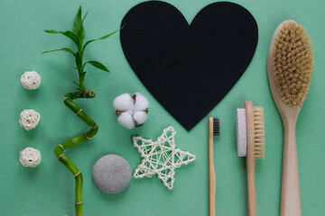 Natural brush with a black heart has space for text. Zero waste. Ecology and nature protection. Copyspace.