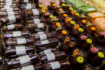 Naklejka premium Bruges, Flanders, Belgium, Europe - October 1, 2019. Belgian chocolate in a traditional chocolate shop in Bruges (Brugge) Belgium. Chocolate candy in a store window. Stand with chocolates.