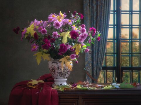 Autumn still life with bouquet of chrysanthemums in a vase