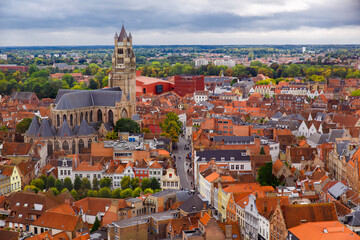Obraz premium Bruges, Flanders, Belgium, Europe - October 1, 2019. Autumn scenery of medieval world heritage city, Bruges (Brugge) from the Belfry tower. Aerial view of St. Salvator's Cathedral