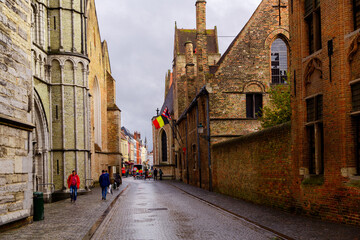 Fototapeta premium Bruges, Flanders, Belgium, Europe - October 1, 2019. Medieval old brick houses on the ancient streets in Bruges (Brugge) in autumn