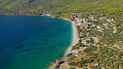 Aerial drone photo of beautiful seaside village and turquoise beach of Porto Germeno, Corinthian gulf, West Attica, Greece