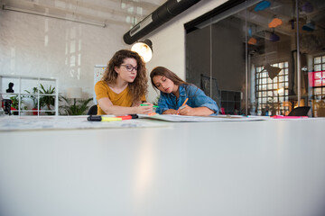 Obraz premium Two young female designers working together on a project