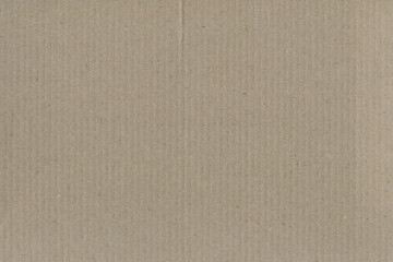 Close up of a light brown vintage rough sheet of carton. Cardboard paper texture with a blank background. Empty papercraft surface. Recycled environmentally friendly material.