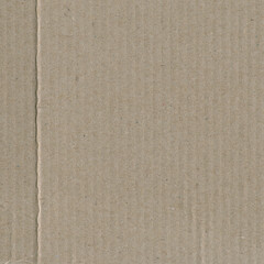 Close up of a light brown vintage rough sheet of carton. Cardboard paper texture with a blank background. Empty papercraft surface. Recycled environmentally friendly material.
