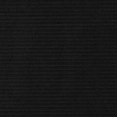 A black vintage rough sheet of carton. Recycled environmentally friendly cardboard paper texture. Simple gray minimalist papercraft background.