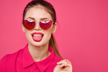 Woman in pink shirt and brown glasses cropped view fashion model emotions gesturing hands portrait