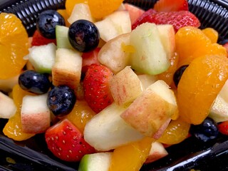 Fruit bowl with blueberries, strawberries, apples, and tangerines