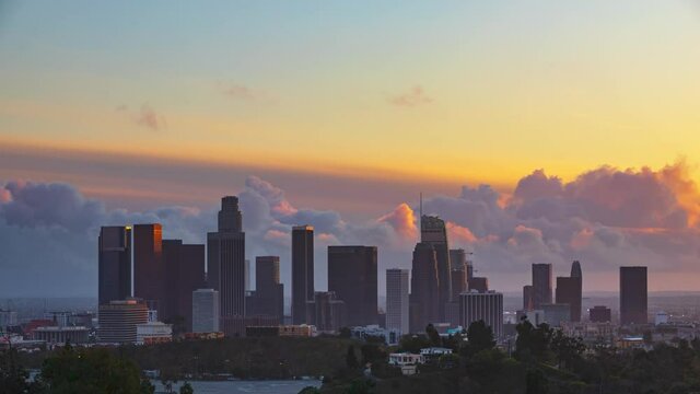 Time Lapse of colorful clouds moving behind the skyline of downtown Los Angeles at sunset