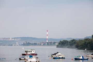 Zemun Quay (Zemunski Kej) in Belgrade, Serbia, on the Danube river, seen in autumn, during the afternoon. Boats can be seen in front, and Belgrade center in background