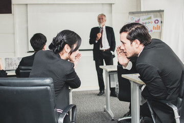 employer, businessman and businesswoman gossip about working as speaker boss explaining on chart with in the conference hall or seminar meeting