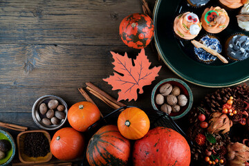 Halloween background  concept.  Cupcakes and pumpkin. Cookies for celebration Halloween.