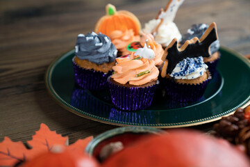 Halloween background  concept.  Cupcakes and pumpkin. Cookies for celebration Halloween.