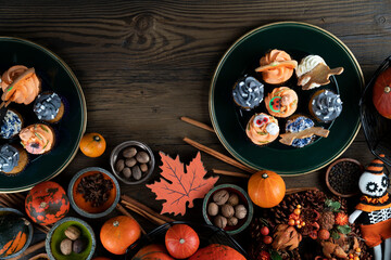 Halloween background  concept.  Cupcakes and pumpkin. Cookies for celebration Halloween.