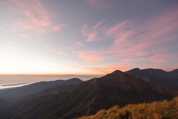 Obraz premium Beautiful view sunrise and foggy landscape from top of mountain in the morning at Rinjani National Park, Lombok, Indonesia