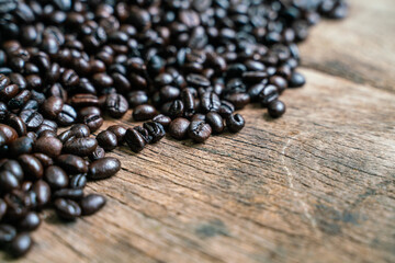 Coffee beans on old rusty brown wood background