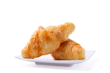 Croissant on white plate isolated over white background with clipping path. Croissant french breakfast.