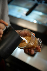 hand holding a cup of coffee