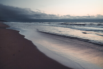 Stormy ocean, golden hour. Abstract seascape background