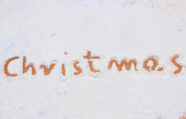 Word christmas written in flour. Baking and festive time concept