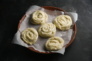 Making preparing of dough Indian flat bread  bakery products. Maida or wheat flour Cooking the dough.  Kerala paratha  porotta  roti Malabar parotta barotta is Indian layered flatbread