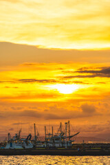 Fototapeta na wymiar 【神奈川県 江ノ島】夕日に照らされた海と船