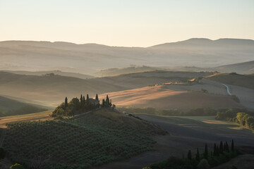 Podere Belvedere Villa in Val d'Orcia Region in Tuscany, Italy at Sunrise or Dawn near San Quirico on a Summer Morning
