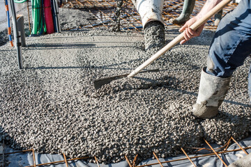 mixer truck pouring concrete on the construction site - 384301333