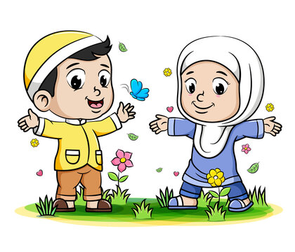 Boy and girl Muslim Kids playing with butterfly in the park