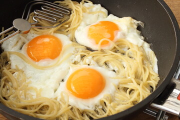 Pasta with egg in the pan