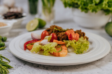 Herbs Fried Pork with Chili, Tomato, Cucumber, Carrot, and Fresh pepper