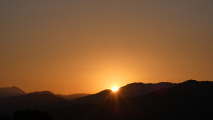 Sun rising over hills in southern Andalusia