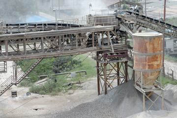 Loading of ship cargo gold with bulk cargo bauxite. Dusty atmosphere.