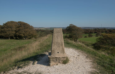 Concrete Trig Point or Triangulation Station on the Top of the Chalk Grassland at Devil's Dyke Hill on the South Downs in Rural West Sussex, England, UK