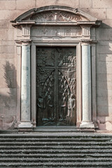 Detail of the door with columns and bas-relief. Viterbo Cathedral. Italian: Duomo di Viterbo, or Cattedrale di San Lorenzo is a Roman Catholic cathedral in the Lazio region in the center of italy.
