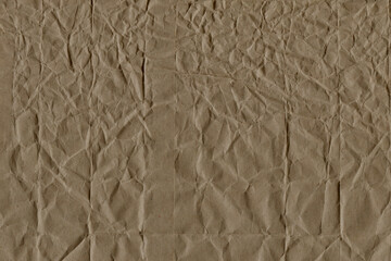 Classic vintage and old looking crumpled paper background. Retro cardboard texture. Grunge paper for drawing. Ancient book page. Present wrapping.