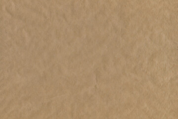 Classic vintage and old looking crumpled paper background. Retro cardboard texture. Grunge paper for drawing. Ancient book page. Present wrapping.