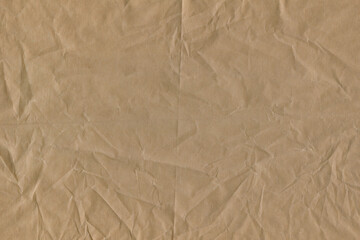 Classic vintage and old looking crumpled paper background. Retro cardboard texture. Grunge paper for drawing. Ancient book page. Present wrapping.