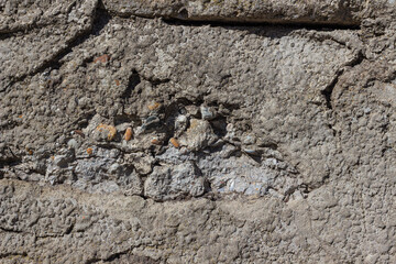 The texture of the old concrete stone wall. Background