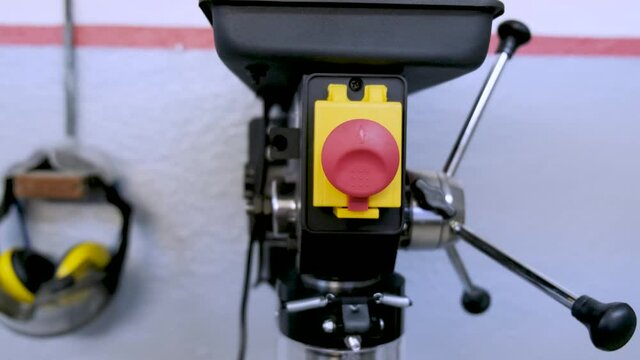 Locksmith tools - Black new drilling machine on a metal table