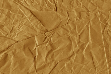 Classic vintage and old looking crumpled paper background. Retro cardboard texture. Grunge paper for drawing. Ancient book page. Present wrapping.