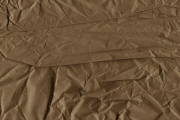 Classic vintage and old looking crumpled paper background. Retro cardboard texture. Grunge paper for drawing. Ancient book page. Present wrapping.