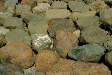 Background from a stone of igneous rock. Wallpaper made of textures of boulders of volcanic origin....